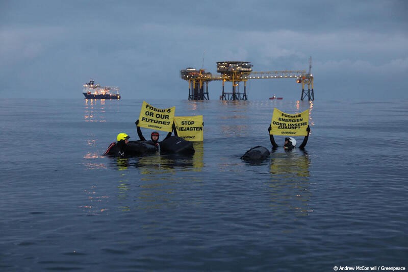Activists swim to oil rig to show that Denmark is not as green as people think